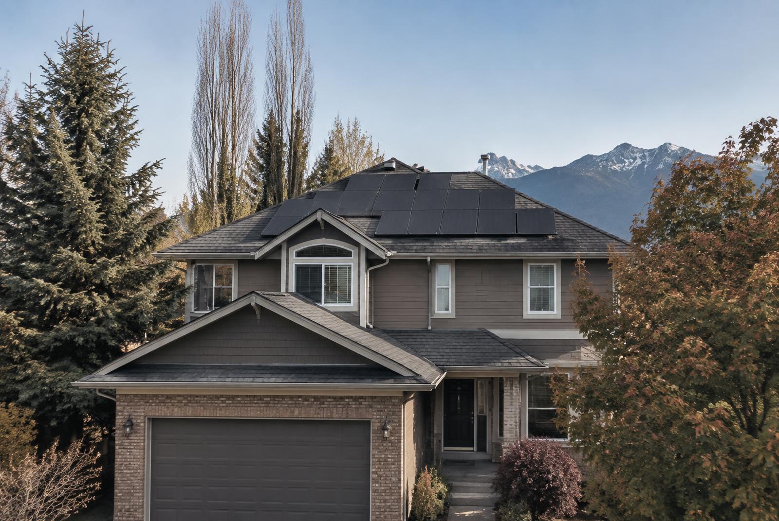 Solar panels installed on the sloped roof of a detached Ontario home